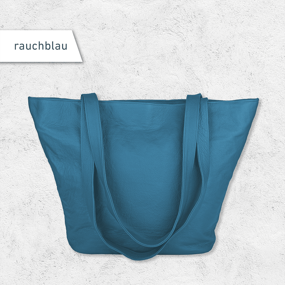 Eine Handtasche aus Leder in der Farbe rauchblau.